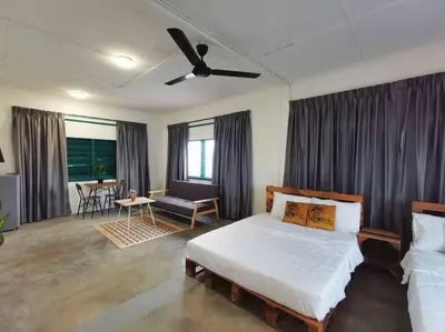 a bedroom with a bed and a ceiling fan at Ipoh town centre-retro 4pax (studio 6) in Ipoh