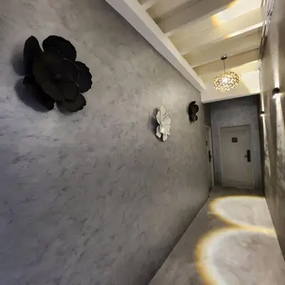 a hallway with flowers on the wall of a building at Ipoh town centre-retro 4pax (studio 6) in Ipoh