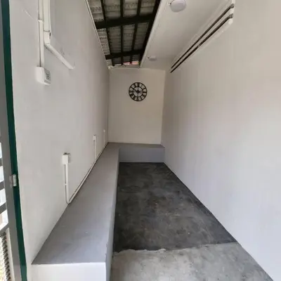 an empty hallway with a clock on the wall at Ipoh town centre-retro 4pax (studio 6) in Ipoh