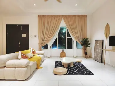 a living room with a couch and a table at Botani Ipoh wabi sabi inshome 18 in Ipoh