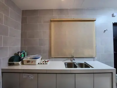 a kitchen counter with a sink and a window at Botani Ipoh wabi sabi inshome 18 in Ipoh