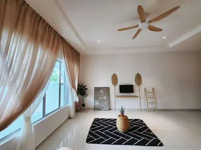 a living room with a ceiling fan and a large window at Botani Ipoh wabi sabi inshome 18 in Ipoh