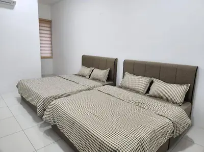two beds sitting next to each other in a room at Botani Ipoh wabi sabi inshome 18 in Ipoh