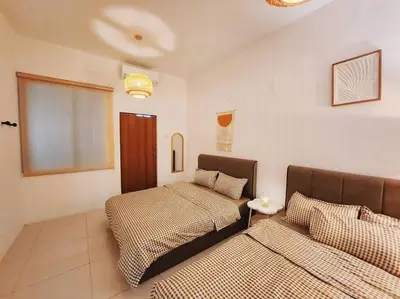 a bedroom with two beds in a room at Botani Ipoh wabi sabi inshome 18 in Ipoh