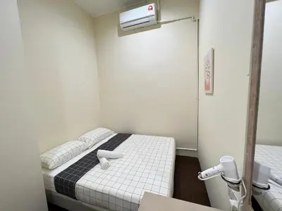 a small room with two beds and a heater at myROOM @ Mandalay Georgetown, Off Jln Burma, Gurney Drive in George Town