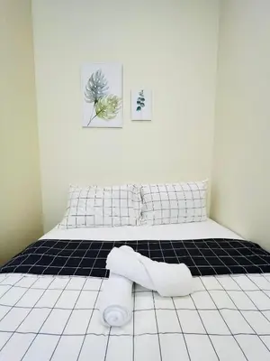 a bedroom with a bed with a towel on the floor at myROOM @ Mandalay Georgetown, Off Jln Burma, Gurney Drive in George Town