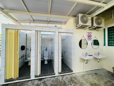 a bathroom with two sinks and a toilet at myROOM @ Mandalay Georgetown, Off Jln Burma, Gurney Drive in George Town