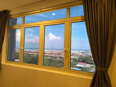 a window with a view of a city at 118 Apartment Tanjung Tokong by Yen's Sojourn in George Town