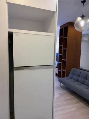 a large mirror in a living room with a couch at 118 Apartment Tanjung Tokong by Yen's Sojourn in George Town