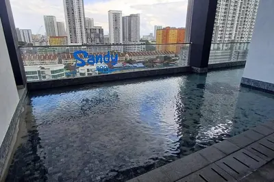 a view of a body of water from a building at Stylish Urban Suite Penang - with infinite pool in Jelutong