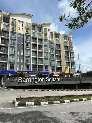 a large building with a sign in front of it at Alliv NSF Studio & 1 Bedroom Apartment Stay in Brinchang