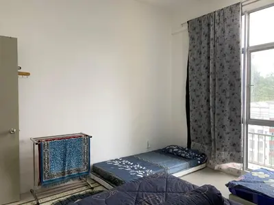 a room with two beds and a window at Alliv NSF Studio & 1 Bedroom Apartment Stay in Brinchang