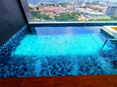 a swimming pool in the middle of a building at The Horizon Ipoh 2BR L12 by Grab A Stay in Ipoh