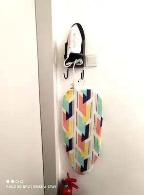 a colorful umbrella is hanging on a wall at The Horizon Ipoh 2BR L12 by Grab A Stay in Ipoh