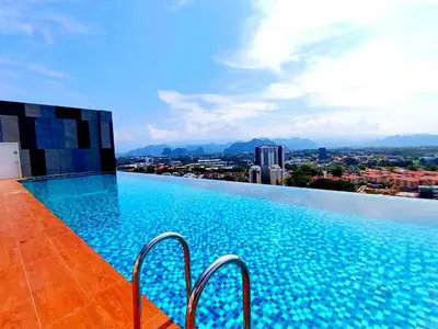 a swimming pool on the roof of a building at The Horizon Ipoh 2BR L11 by Grab A Stay in Ipoh