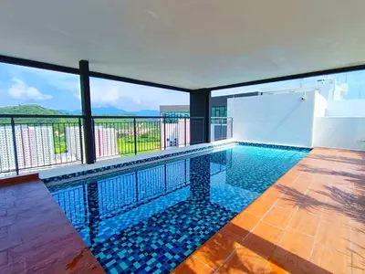 a swimming pool with a view of the mountains at The Horizon Ipoh 2BR L11 by Grab A Stay in Ipoh