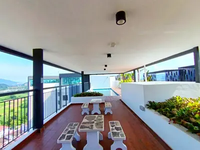 a balcony with views of the ocean and mountains at The Horizon Ipoh 2BR L11 by Grab A Stay in Ipoh
