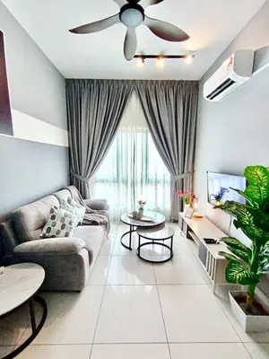 a living room with a couch and a ceiling fan at The Horizon Ipoh 2BR L11 by Grab A Stay in Ipoh