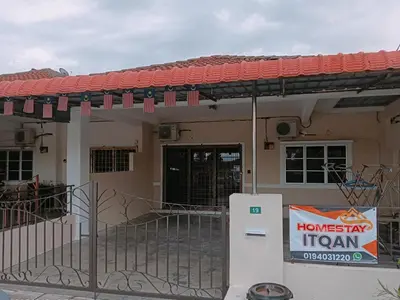 a house with a refrigerator in front of it at Homestay Itqan Seri Iskandar in Seri Iskandar
