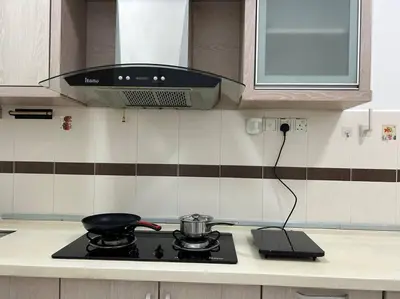 a stove top with a pot on it in a kitchen at Cendana House Juru Autocity Bkt Minyak Batu Kawan IKEA in Simpang Ampat