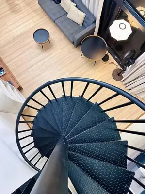 a spiral staircase in a living room with a couch at (New) Fettes Villa for 20Pax @CentralPenang/Gurney in George Town