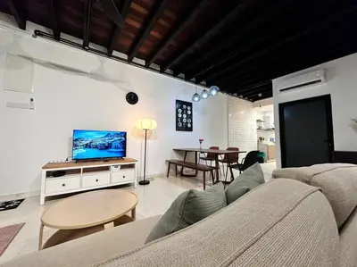 a living room with a couch and a tv and a table at (New) Fettes Villa for 20Pax @CentralPenang/Gurney in George Town
