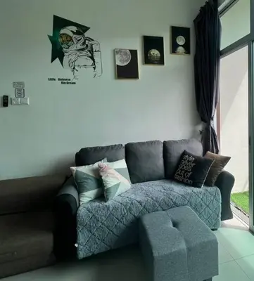 a living room with a gray couch in a room at BLUE DOME (Space) @ Night Market, Cameron. 2R2B in Brinchang
