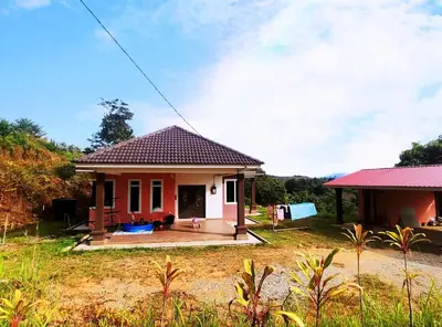 a small house with a red roof at Aish Homestay in Kuala Lipis
