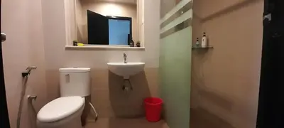 a small bathroom with a toilet and a sink at Cameron Square in Brinchang