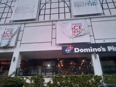 a building with signs on the side of it at Cameron Square in Brinchang