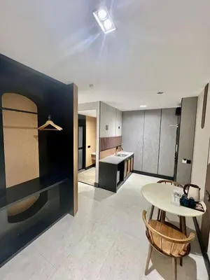 a kitchen with a table and a table and a table and a kitchen at Urban Inn, Serai Wangi in Padang Serai