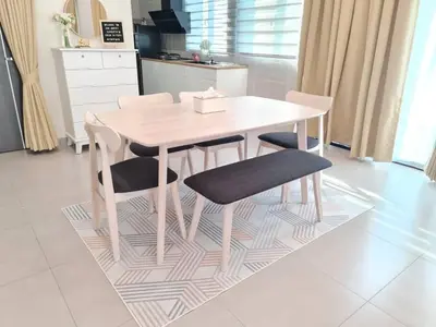 a wooden table and chairs in a kitchen at One Sweet Homestay Kulim Hi-Tech utk Msliim shj in Kulim