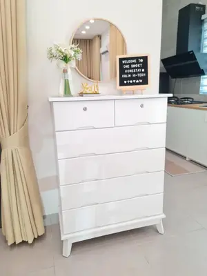 a white dresser with a mirror on top of it at One Sweet Homestay Kulim Hi-Tech utk Msliim shj in Kulim