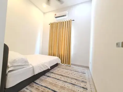 a small bedroom with a bed and a shower at One Sweet Homestay Kulim Hi-Tech utk Msliim shj in Kulim