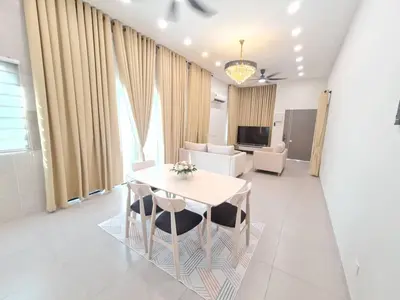 a dining room with a white table and chairs at One Sweet Homestay Kulim Hi-Tech utk Msliim shj in Kulim