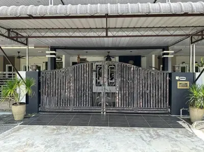 a gate in a building with two potted plants at Pa&Ma HomeStay Kulim 4R3B fully aircond in Kulim