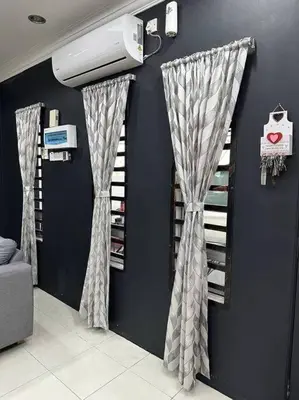a room with drapes on the wall and aperature at Pa&Ma HomeStay Kulim 4R3B fully aircond in Kulim