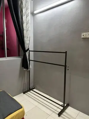 a bedroom with a bed and a window with a curtain at Pa&Ma HomeStay Kulim 4R3B fully aircond in Kulim