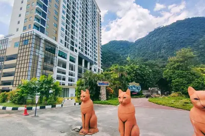 a group of cat statues in front of a building at Sunway Onsen Suites - Theme Park Tambun Ipoh by Ryokan Management in Tambun