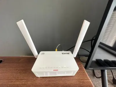 a white laptop computer sitting on top of a table at New Brand KTV SET, Netflix, 3 Queen Bed High Floor in Jelutong