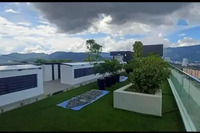 a balcony with green grass and trees on a building at New Brand KTV SET, Netflix, 3 Queen Bed High Floor in Jelutong