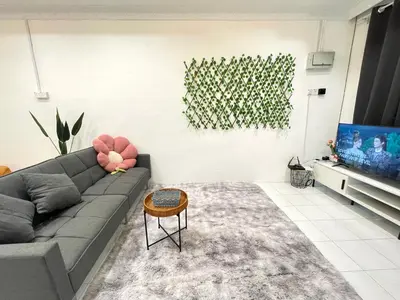 a living room with a couch and a tv at Cozy64#6pax#Netflix#NearAeonAlma#BM#5kmtoIconicPoint in Bukit Mertajam