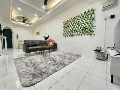 a living room with a couch and a rug at Cozy64#6pax#Netflix#NearAeonAlma#BM#5kmtoIconicPoint in Bukit Mertajam