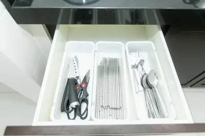 a white tray with utensils in a drawer at Beach side spacious 5BR 20pax pool house in Batu Ferringhi