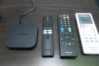 three remote controls and a mouse sitting on a table at Beach side spacious 5BR 20pax pool house in Batu Ferringhi