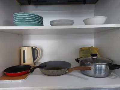 a kitchen counter with bowls and dishes on shelves at SR28-HousePrivate-3room-BigHouse in Bayan Lepas