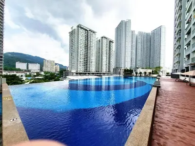 a large swimming pool in a city with tall buildings at SR28-HousePrivate-3room-BigHouse in Bayan Lepas