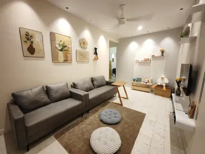 a living room with a couch and a tv at TL LEGEND HOMESTAY Ipoh garden east in Ipoh