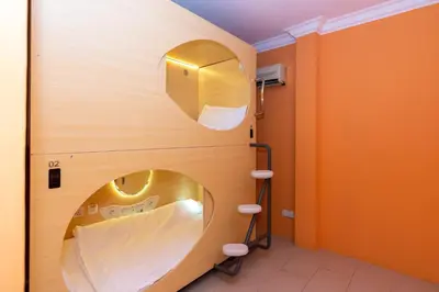 a bathroom with a sink and a mirror at Momostay in George Town