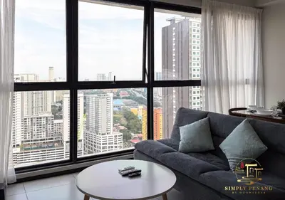 a living room with a couch and a large window at Urban Suites by Simply Penang in Jelutong